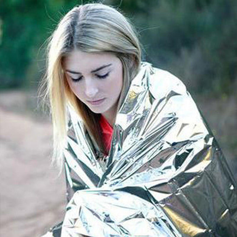 Web Based Human Body Hypothermia Lifesaving Emergency Blanket In Outdoor Field