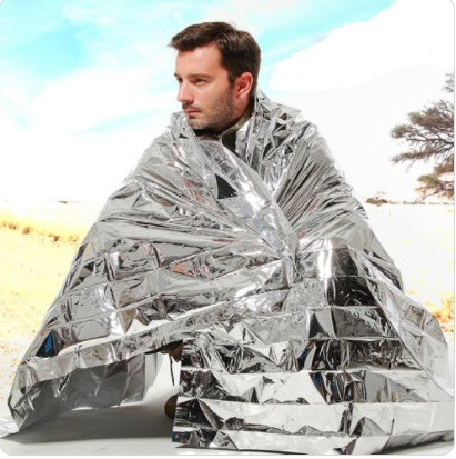 Web Based Human Body Hypothermia Lifesaving Emergency Blanket In Outdoor Field